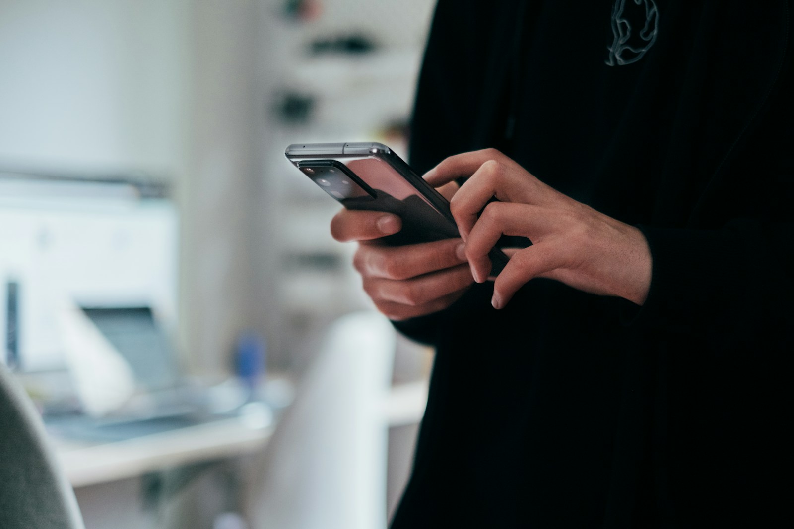 person messaging on a smartphone